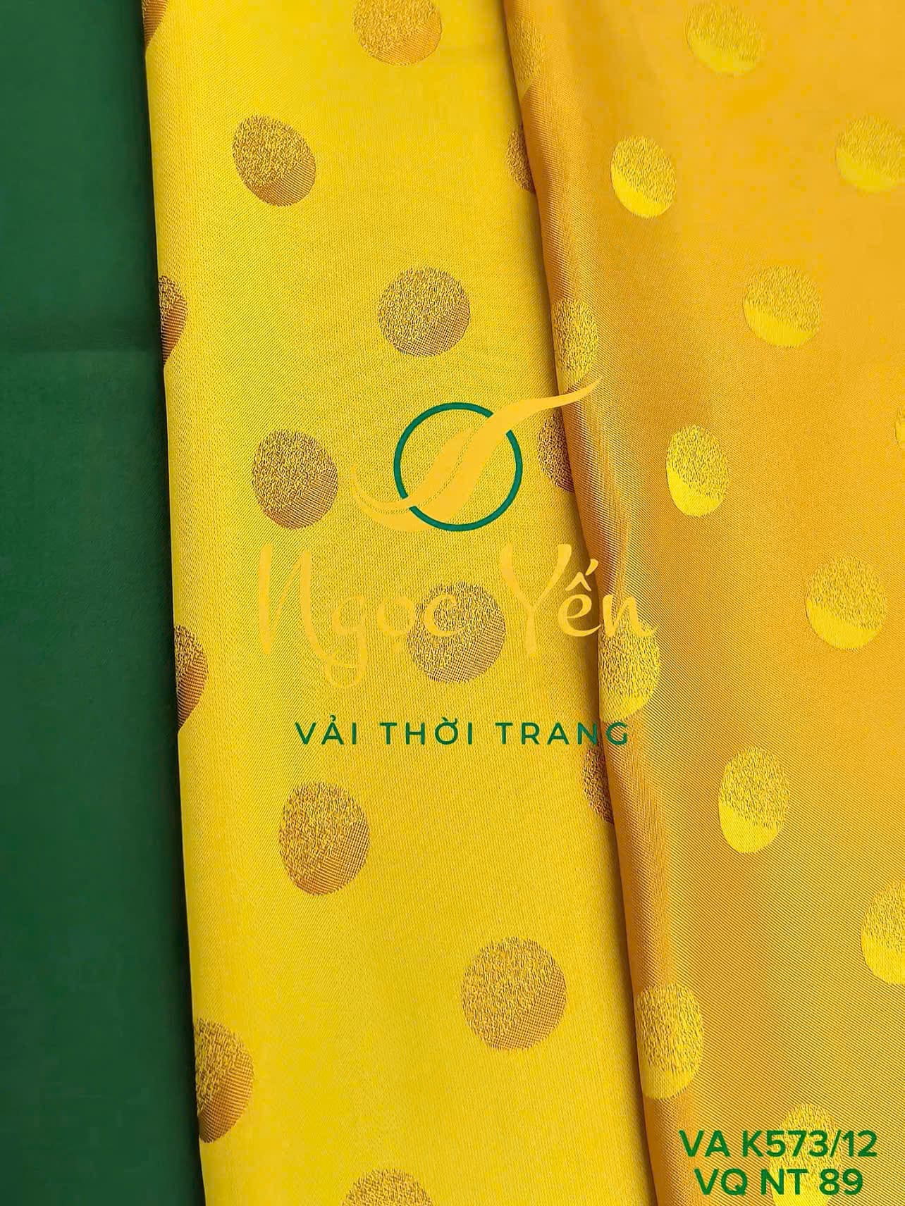 VA K573/12-Vải áo dài lụa họa tiết chấm bi vàng